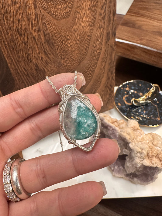 Emerald in Quartz wire wrapped pendant