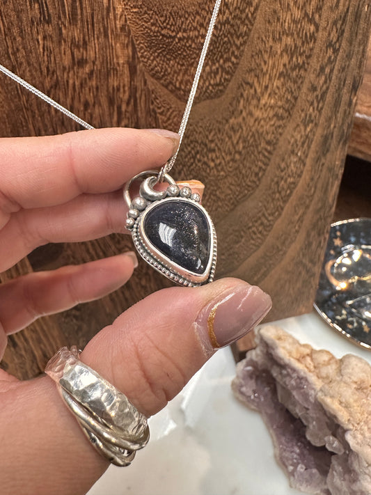 Galaxy iolite in solder silver pendant